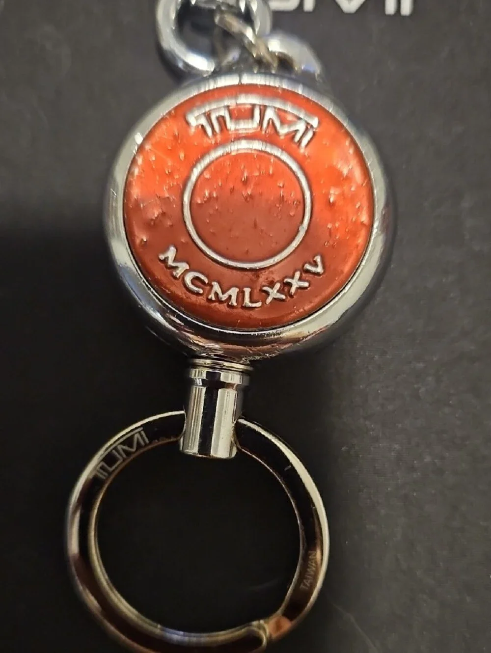 Tumi Orange Round Key Fob with Silver Hardware-retractable
